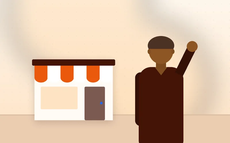 A small shop owner checks website analytics on a smartphone inside a busy Indian market stall.