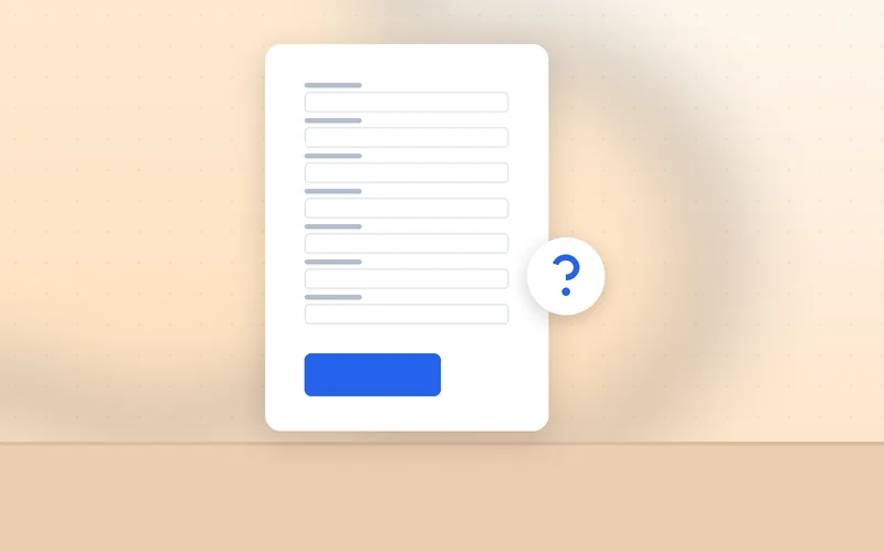 Hesitant hands pause over the keyboard above a long contact form on screen.